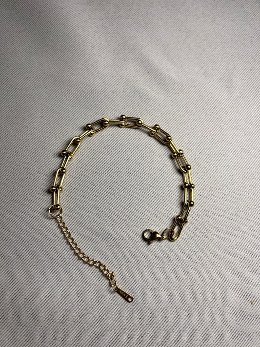 Armband T Gold