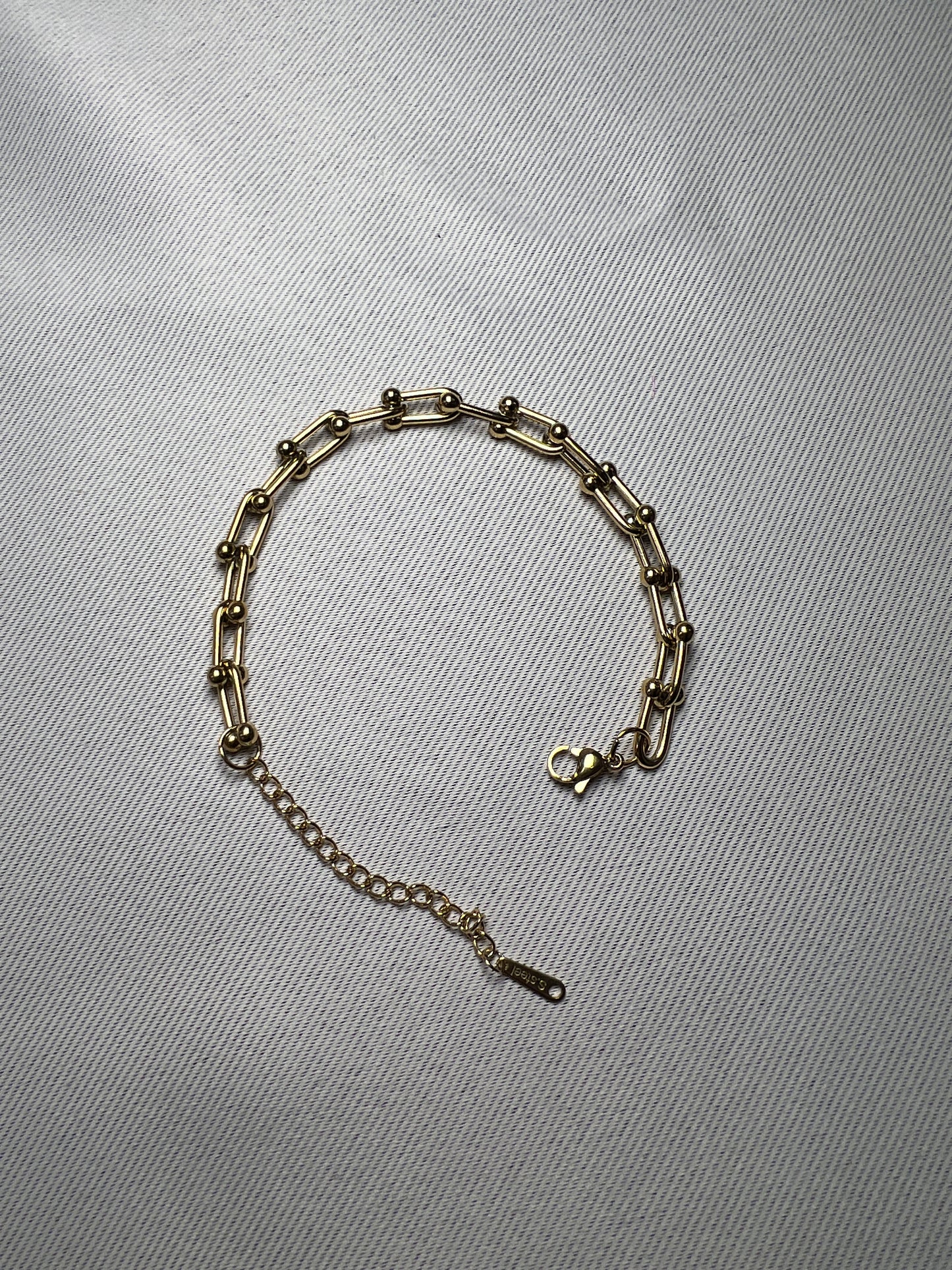 Armband T Gold